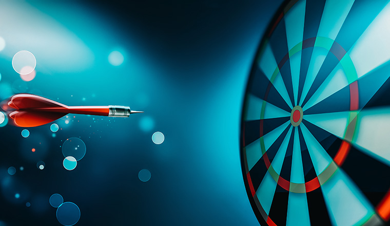 dartboard with arrow about to hit