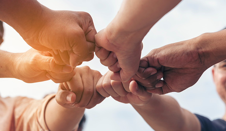 Close up hands Teamwork group of multi racial people meeting join hands. Diversity people hands join empower partnership teams connect volunteer community. Diverse multiethnic Partners team together