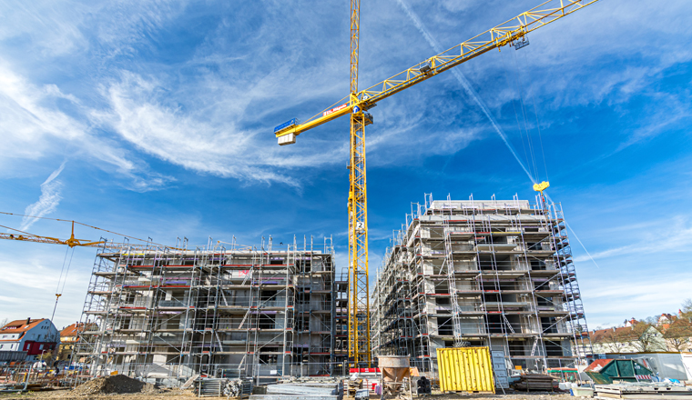 Construction site with crane on a sunny day in Tübingen, Germany (editorial)