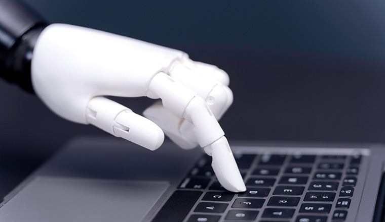 Chat ai, artificial intelligence, robo advisor, robotic concept. Robot finger point to laptop button. Robotic hand pressing a keyboard on a laptop, robot hand chat ai pressing computer keyboard enter
