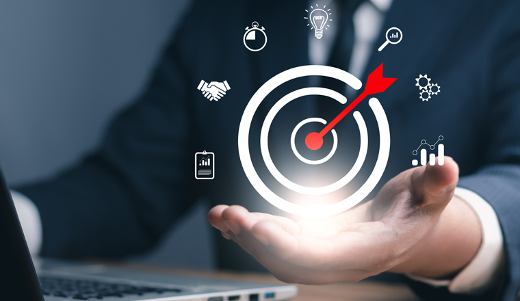 Concept of business strategy and future sustainable business finance action plan. Hand holding target board for creative and set up business objective target and success and business goals concept.	