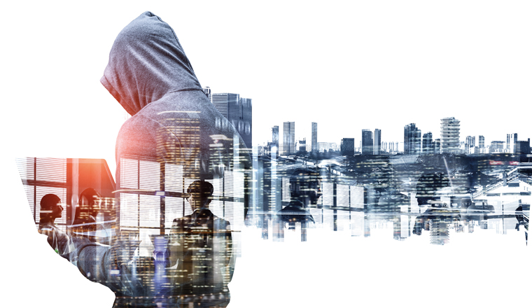 Double exposure of hacker man working on laptop and cityscape on white background
