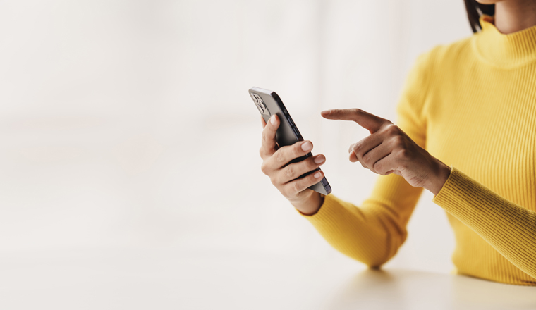 Portrait of a young woman holding a mobile phone to use social media on a smartphone. Communicate via the Internet on a smartphone. concept of using technology in communication