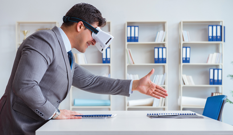 The businessman with virtual reality glasses in the office