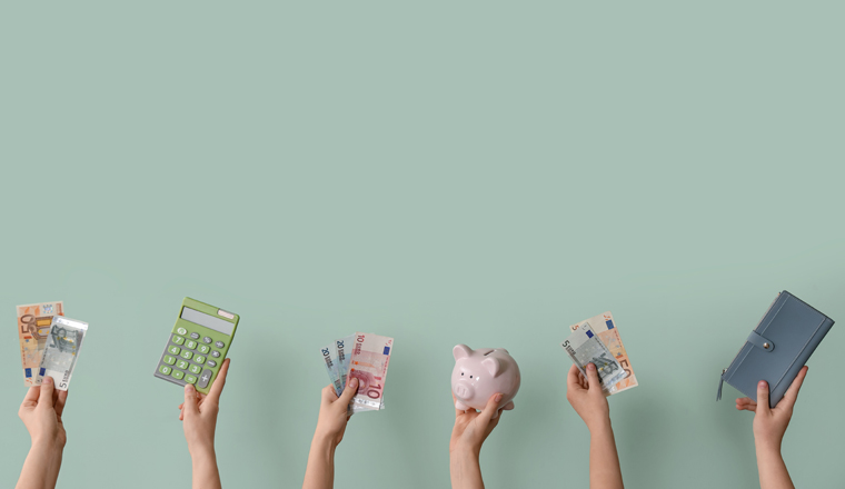 Women with euro banknotes, piggy bank and wallet on green background