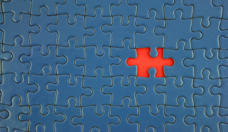 Close up of a Blue Jigsaw with missing piece