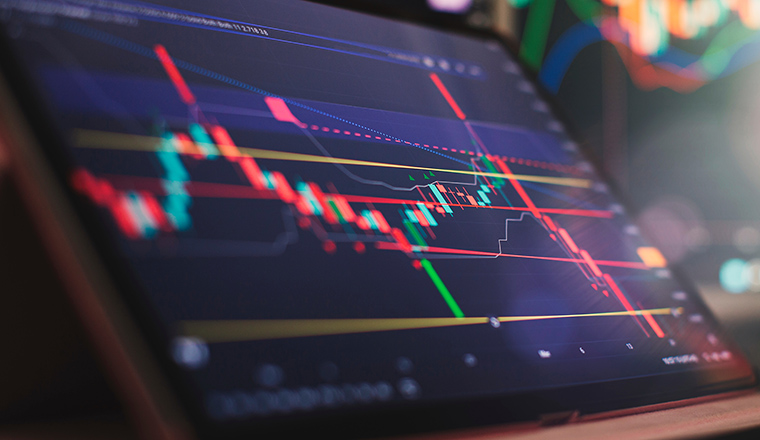 Businessman hand working on analyzing investment charts.  financial and investment