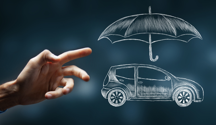 hand presses on the umbrella and the car. concept car protection and insurance