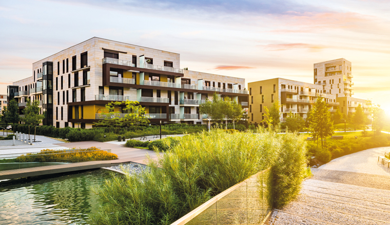 Residential building in the public green park during sunrise