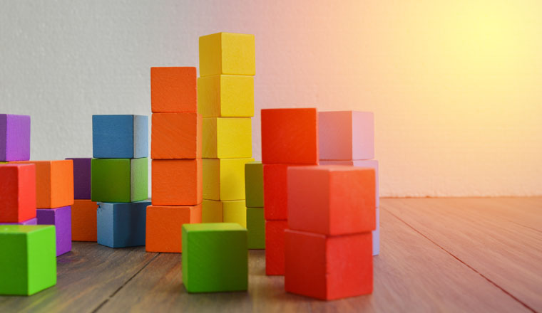 Colorful stack of wood cube building blocks