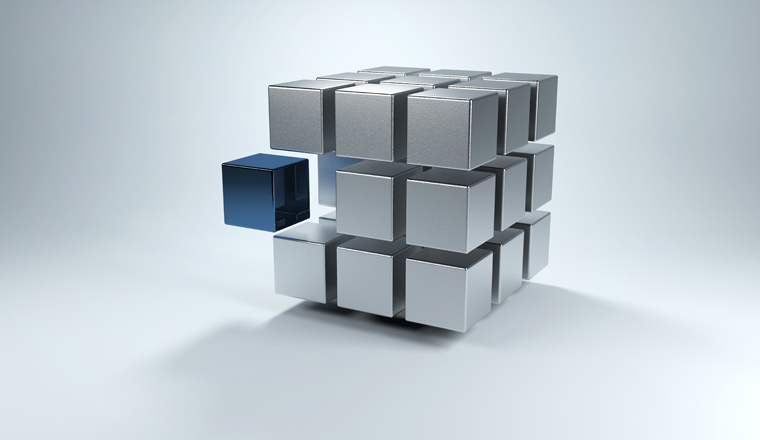 Floating 3D cube with sections in gray and one in blue that moves away from the whole