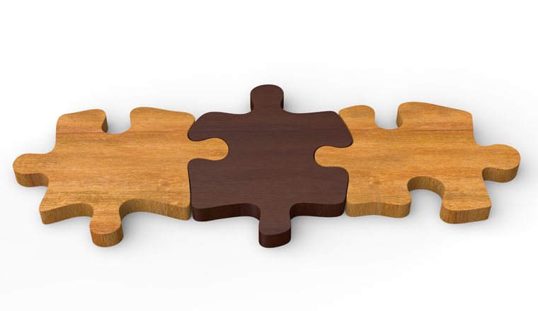 Three wooden puzzle pieces put together