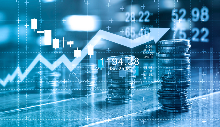 Finance and business concept. Investment graph and rows growth and of coins on table, blue color tone.  