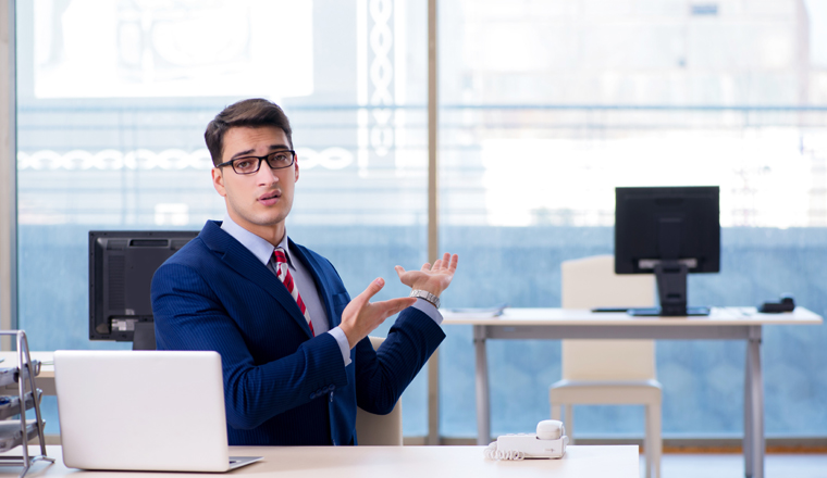 Businessman employee unhappy about absent employee