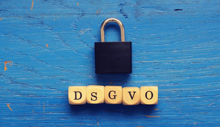 DSGVO concept image with small wooden dices on a wooden background