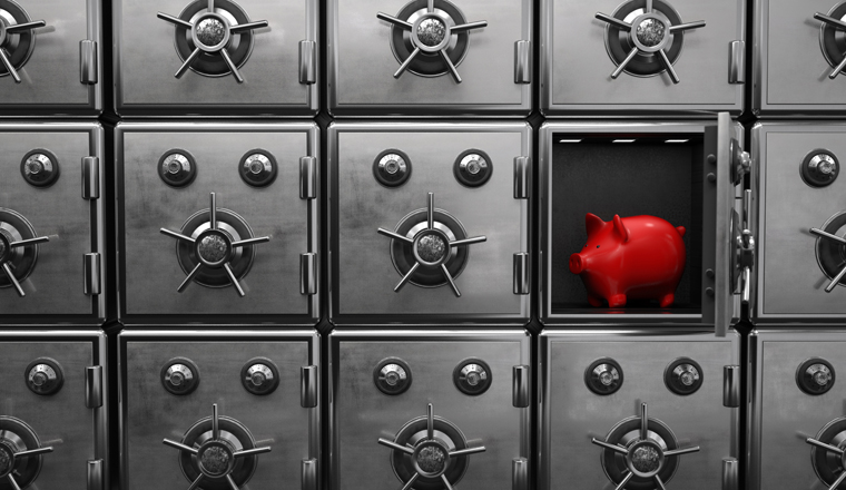 A red piggy bank in the opened strongbox. 3d illustration.