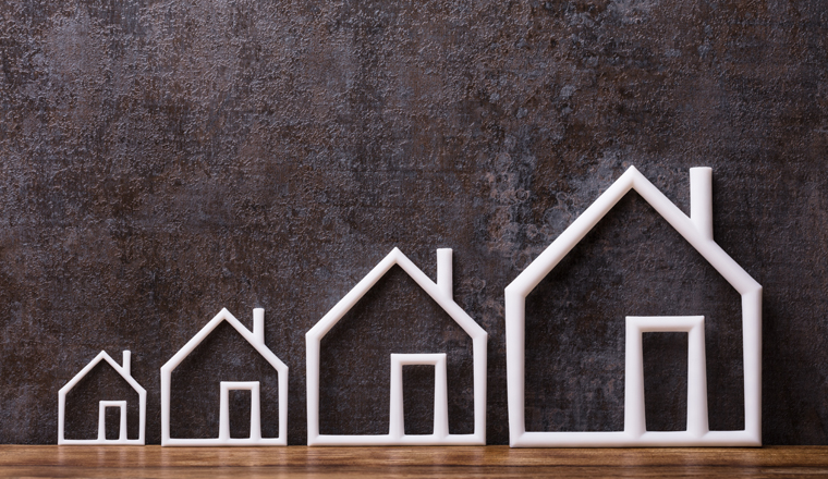 Increasing White Outlined Houses Against Rustic Background