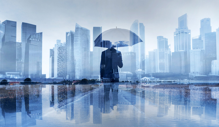 insurance concept, risk in business, businessman with umbrella double exposure