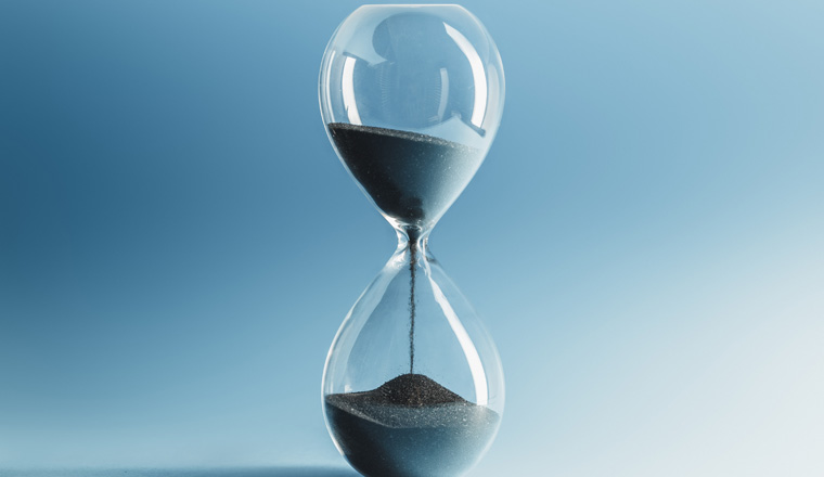 Hourglass on blue background