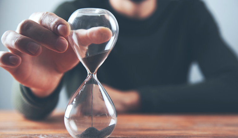 man hand sand clock