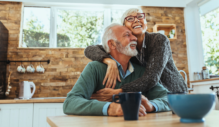 Shot of a mature woman hugging her husband