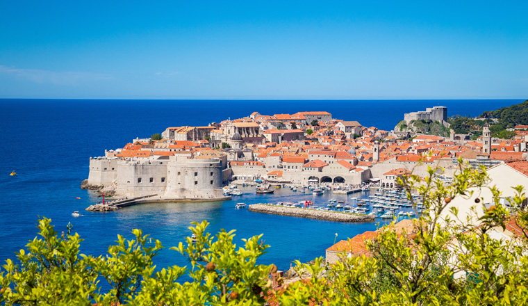 Panoramic aerial view of the historic town of Dubrovnik, one of the most famous tourist destinations in the Mediterranean Sea, from Srt mountain on a beautiful sunny day in summer, Dalmatia, Croatia