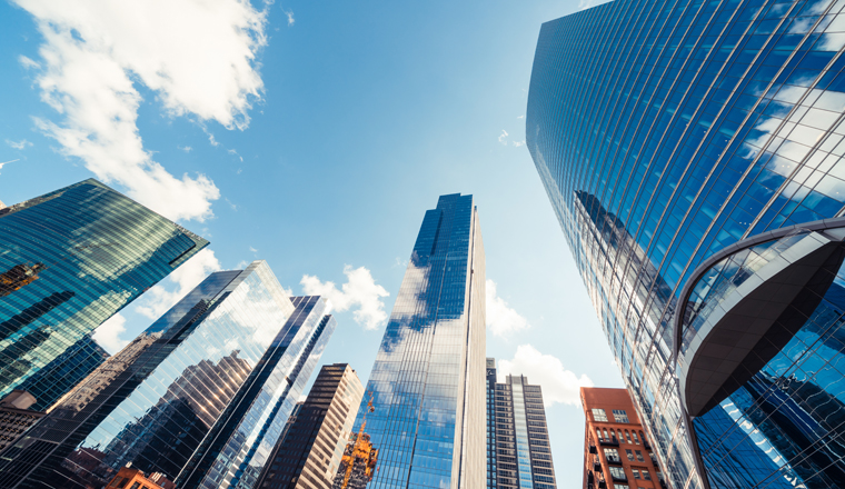 Modern tower buildings or skyscrapers in financial district with cloud on sunny day in Chicago, USA. Construction industry, business enterprise organization, or communication technology concept