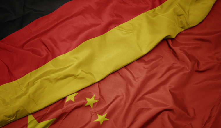 waving colorful flag of china and national flag of germany. macro