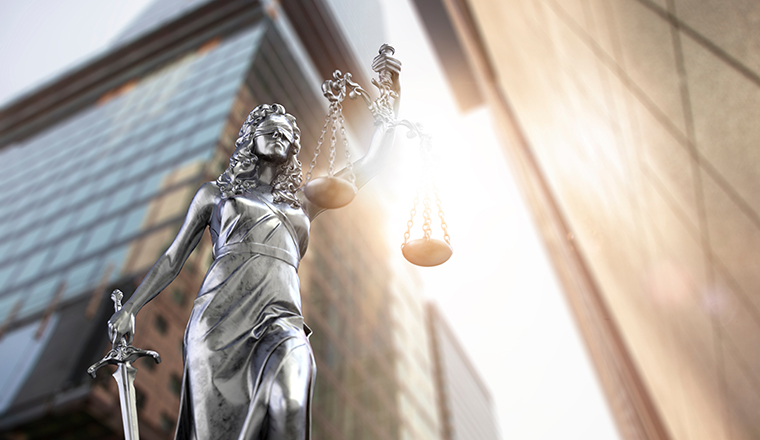 Lady justice statue in the city. 3d illustration.