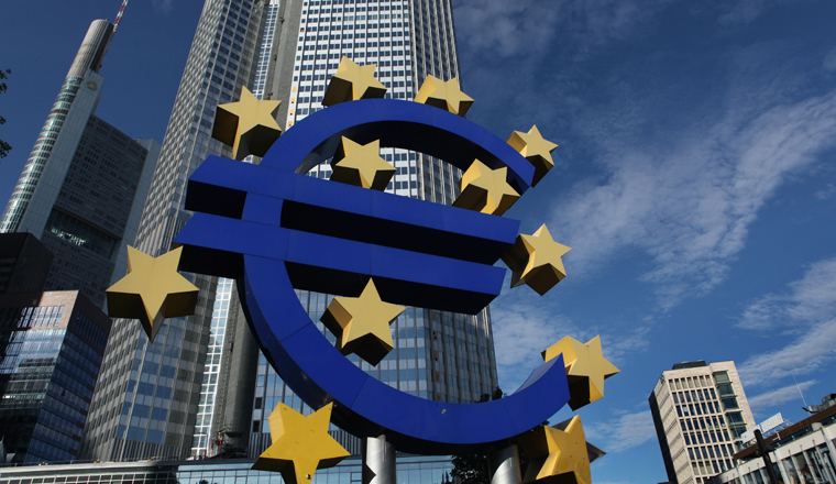 FRANKFURT AM MAIN, GERMANY - JUNE 14, 2015: Euro logo by German visual artist Ottmar Hörl in front of the Eurotower in Frankfurt am Main, Hesse, Germany. 