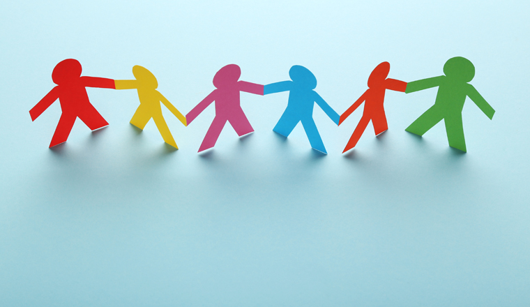 Colorful paper chain people on blue background