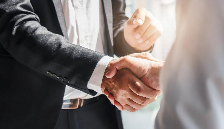 business background of businessman having handshake