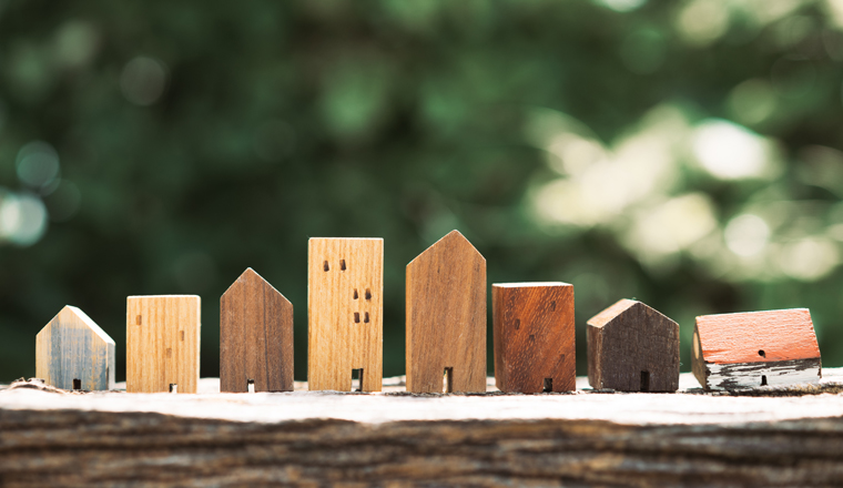 House model on wood table. Real estate agent offer house, property insurance and security, affordable housing concepts