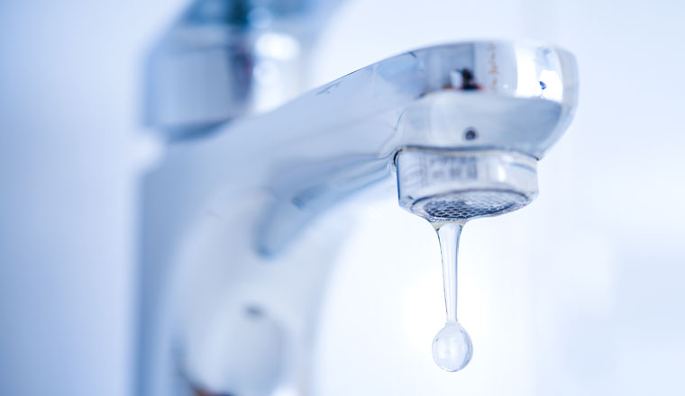 Hygiene concept. Water flowing from faucet.