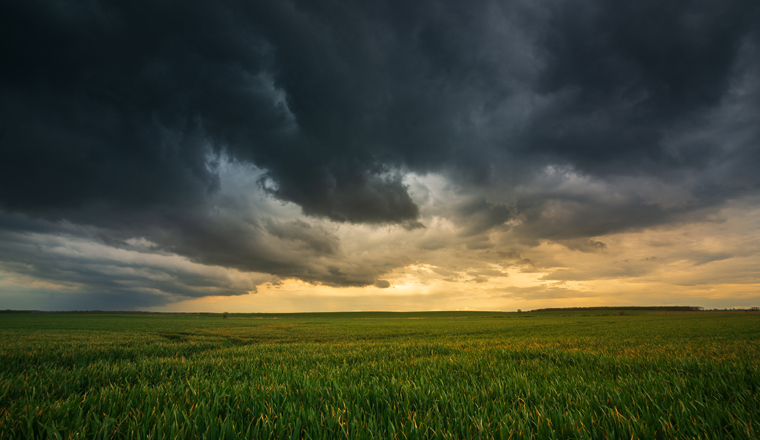 Storm clouds , dramatic dark sky over the rural field landscape