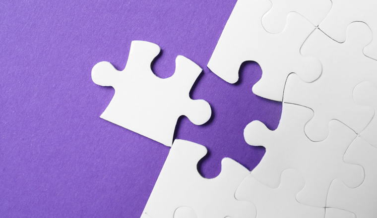 White puzzle with unfitting piece on purple background, flat lay