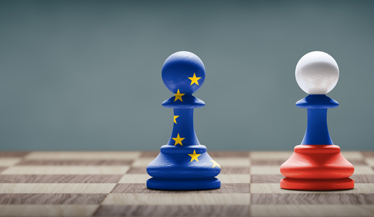 European Union and Russia conflict. Flags on chess pawns on a chess board. 3D illustration.