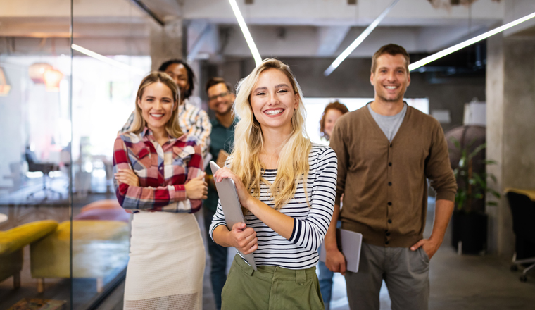 Successful group of business people, designers at work in office