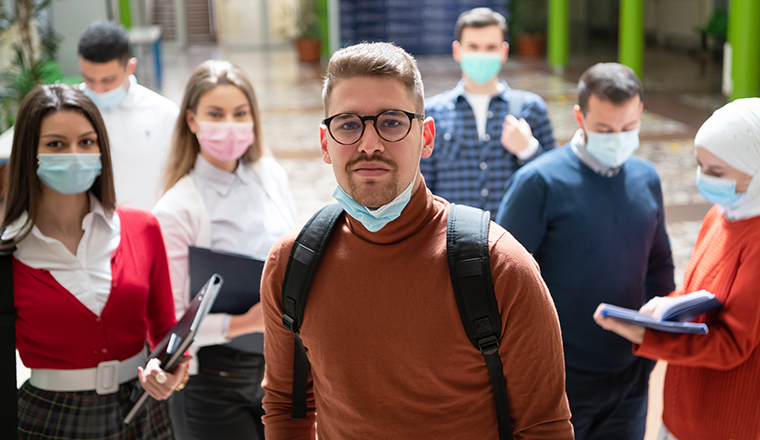 Portrait of multiethnic students group at university wearing protective face mask. New normal, education, healthcare and coronavirus covid19 pandemic concept