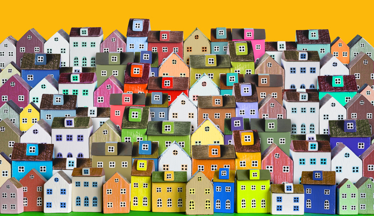 City background, banner with rows of Colorful wooden miniature houses.