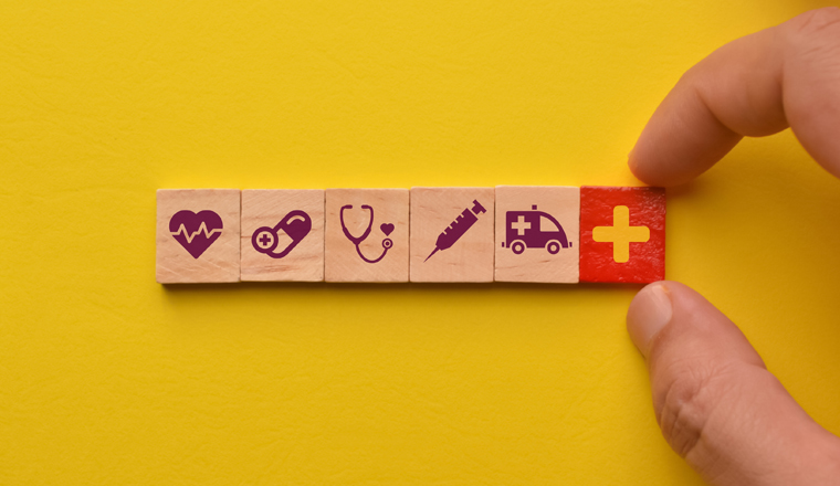 Conceptual of healthcare. Wooden cube blocks with healthcare icons