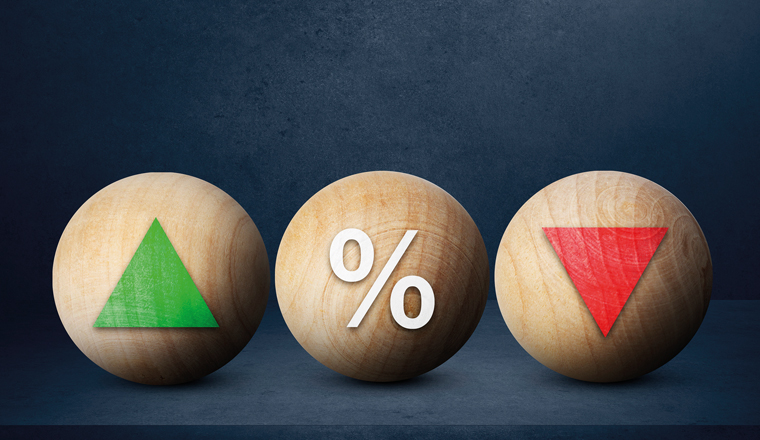 Interest rate financial concept. wooden ball with icon green arrow up, percentage and red arrow down 