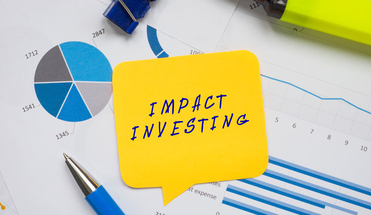 Financial concept about IMPACT INVESTING with phrase on the page. 
