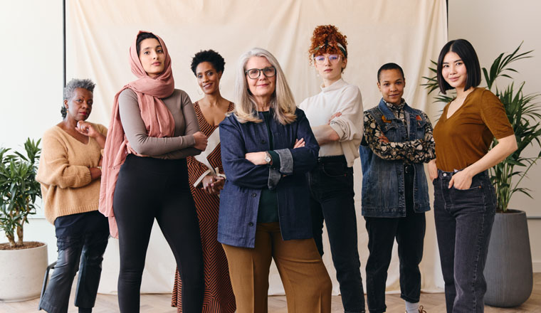 International Women's Day portrait of multi ethnic mixed age range women looking confidently towards camera