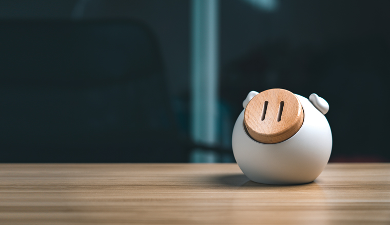 Pig piggy bank on wooden table, future money saving and pensions concept
