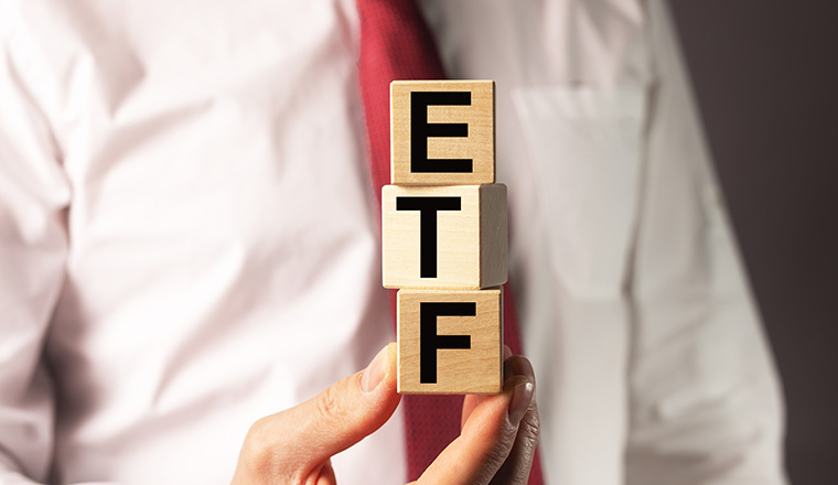 ETF investment word in investors hand. High quality photo