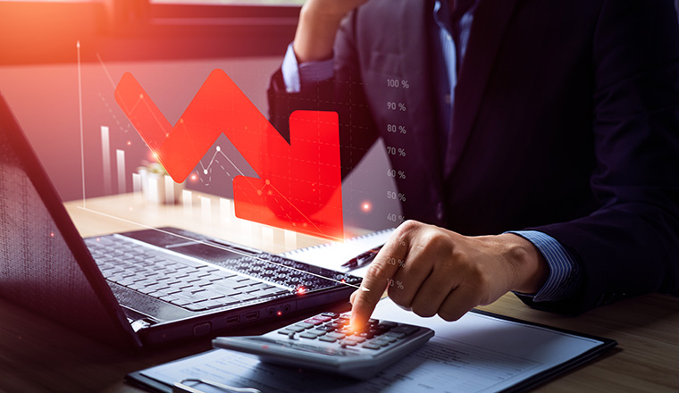 Business recession concept, crisis. business people analyzing sales data and the falling economic graph, Decreased funds and money. Fall of economy, capital reduction. Inflation. Falling income in GDP