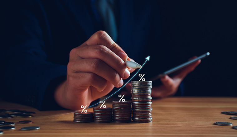 Interest rate and dividend concept. Businessman with percentage symbol and up arrow, Interest rates continue to increase, return on stocks and mutual funds, long term investment for retirement.