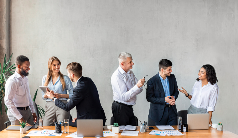 Corporate Lifestyle And Communication. Multiracial Coworkers Different Ages Communicating Standing Near Table During Business Meeting In Modern Office, Panorama With Copy Space, Collage