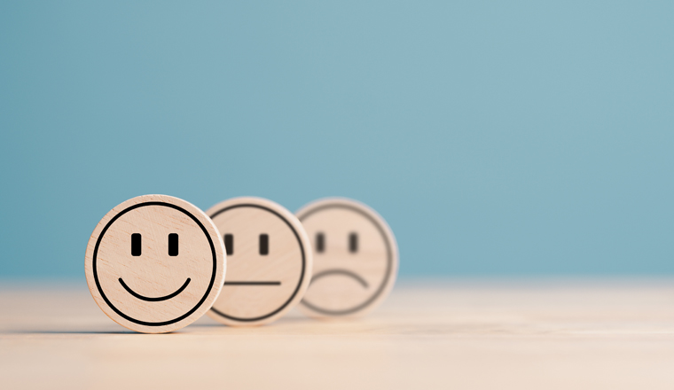 Wooden label with happy normal and sad face icons for experience survey services and products review concept. Customer or Client show Good Neutral or Negative feedback and satisfaction rating.